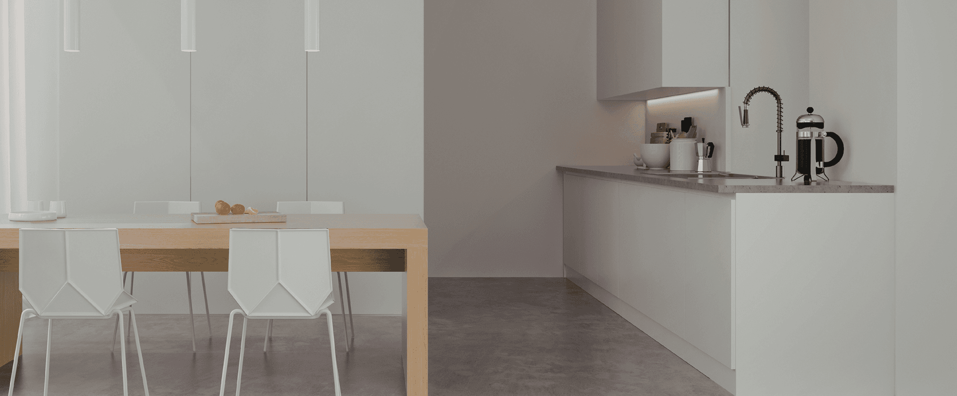 A serene minimalist kitchen with a pale wood dining table and soft natural light